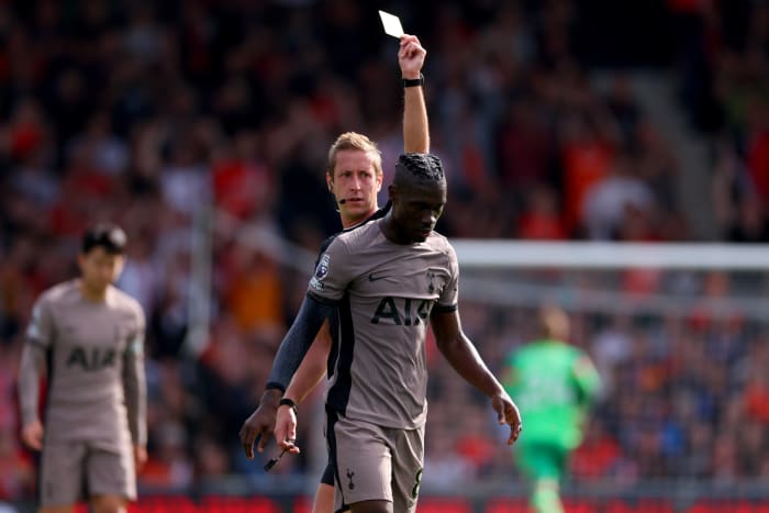 Tottenham Hotspur midfielder Yves Bissouma pictured receiving a card during his team's game against Luton Town in October 2023
